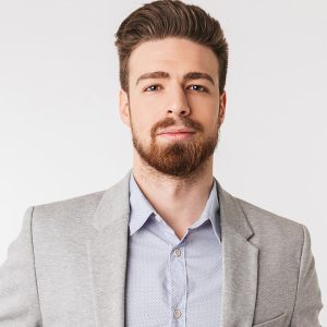 portrait-of-a-confident-young-man-dressed-in-shirt-P4DTYKC