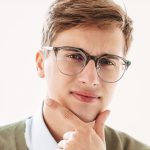 thoughtful-young-guy-student-in-eyeglasses-4FG5USN-min